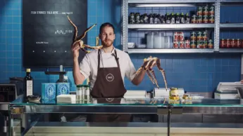 Chef at Mathallen in Tromsø showing some king crab