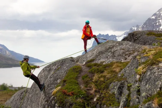 Two guests rock climbing